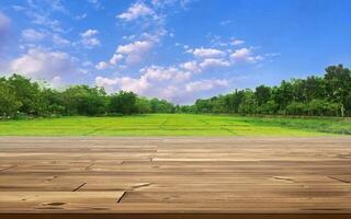 wooden table against rice field background photo