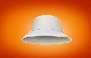 white bucket hat isolated on orange background photo