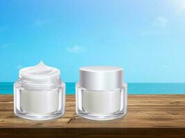Opened and closed cream jar on wooden table with the sea in the background photo