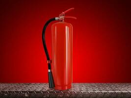 Fire extinguisher on steel background  red background photo