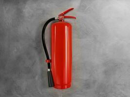 fire extinguisher on cement wall photo