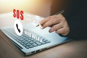 SOS with Emergency app smartphone and Laptop concept, Business people touch  Emergency app at home, call phone, Chat message icon, Emergency application from smartphone for elderly, call for help. photo
