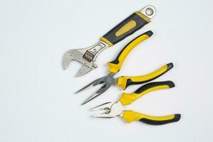 Set of tools for repair in a case on a white background. Assorted work or construction tools. Wrenches, Pliers, screwdriver. Top view photo