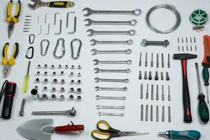 Set of tools for repair in a case on a white background. Assorted work or construction tools. Wrenches, Pliers, screwdriver. Top view photo