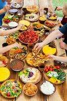 Homemade Romanian Food with grilled meat, polenta and vegetables Platter on camping. Romantic traditional moldavian food outside on the wood table. photo