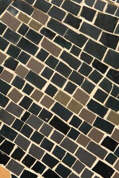 Colorful ceramic mosaic on the walls of the building. Abstract background and texture for design. photo