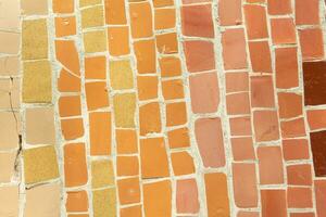 Colorful ceramic mosaic on the walls of the building. Abstract background and texture for design. photo