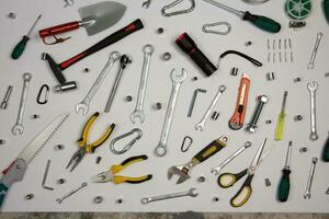 Set of tools for repair in a case on a white background. Assorted work or construction tools. Wrenches, Pliers, screwdriver. Top view photo