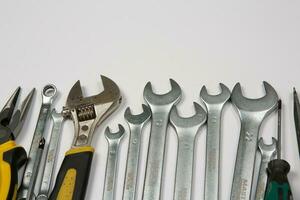 Set of tools for repair in a case on a white background. Assorted work or construction tools. Wrenches, Pliers, screwdriver. Top view photo