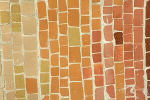 Colorful ceramic mosaic on the walls of the building. Abstract background and texture for design. photo