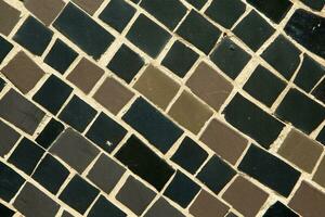 Colorful ceramic mosaic on the walls of the building. Abstract background and texture for design. photo