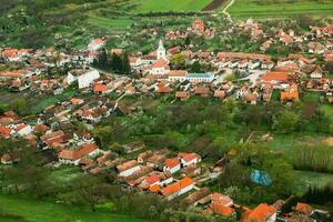 Rimetea is a small village located in Transylvania, Romania. It is situated in the Apuseni Mountains and is known for its picturesque setting and well preserved Hungarian architectural style. photo