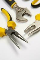 Set of tools for repair in a case on a white background. Assorted work or construction tools. Wrenches, Pliers, screwdriver. Top view photo