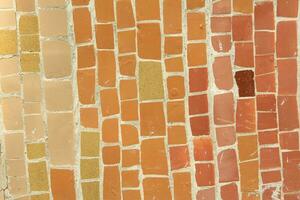 Colorful ceramic mosaic on the walls of the building. Abstract background and texture for design. photo