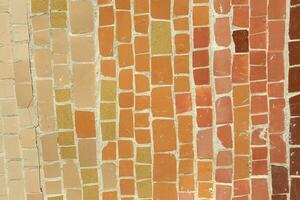 Colorful ceramic mosaic on the walls of the building. Abstract background and texture for design. photo