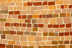 Colorful ceramic mosaic on the walls of the building. Abstract background and texture for design. photo