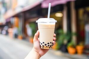 Generative AI illustration of hand holding Taiwan milk tea and blurry background photo