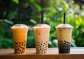 illustration of product photo of 3 plastic cups of boba milk tea, with bubbles, fun, blurry outdoor and nature background