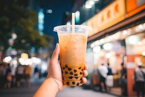 Generative AI illustration of hand holding Taiwan milk tea and blurry background photo