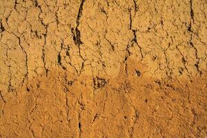 Soil wall texture of old clay house structure. One kind of material make house wall in North Vietnam photo