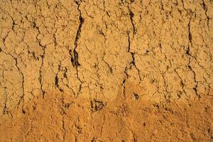 Soil wall texture of old clay house structure. One kind of material make house wall in North Vietnam photo