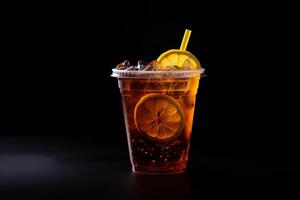 Iced lemon tea on plastic takeaway glass isolated on dark background. ai generated photo