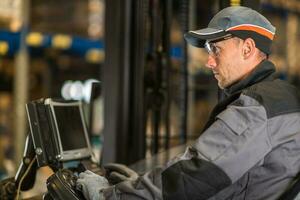 Caucasian fork lift truck operator. photo