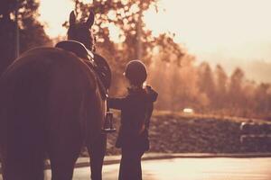 Horse and Rider Enjoying the Sunset Together photo