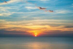 beautiful sunset with seascape view on noen nangphaya viewpoint chanthaburi thailand.Popular waterfront photo spot with a backdrop of the curving coastal road