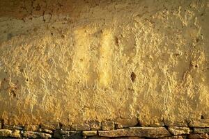 Soil wall texture of old clay house structure. One kind of material make house wall in North Vietnam photo