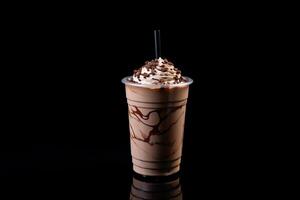 Chocolate milkshake in plastic takeaway cup isolated on black background. photo