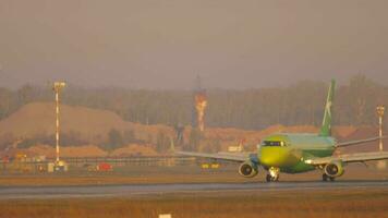 NOVOSIBIRSK, RUSSIAN FEDERATION JUNE 17, 2020 - Embraer S7 Airlines slows down after landing at Tolmachevo airport video