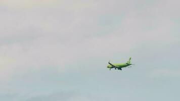 NOVOSIBIRSK, RUSSIAN FEDERATION JUNE 27, 2021 - Airbus of S7 approach before landing to Tolmachevo international airport, Novosibirsk OVB. Long shot, green plane flies in the sky. video