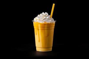 Mango smoothie milkshake in plastic takeaway cup isolated on dark background. photo