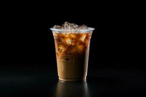 Iced coffee in plastic take-away glass isolated on dark background. ai generated photo