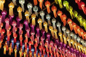 colorful hanging lanterns lighting on night sky in loy krathong festival at northern of thailand photo