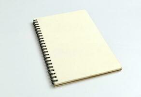 blank spiral notebook on white background for mockup blank template photo
