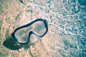 agua gafas de protección en el playa foto