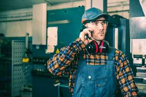 Factory Worker Making Call photo