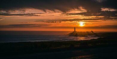 Lighthouse at sunset in California. photo