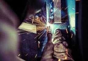 Welding metal parts with sparks. photo