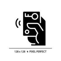 Hand with car remote starter pixel perfect black glyph icon. Wireless automobile key. Innovative technology. Silhouette symbol on white space. Solid pictogram. Vector isolated illustration