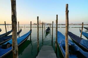 Condolas and wooden pier photo