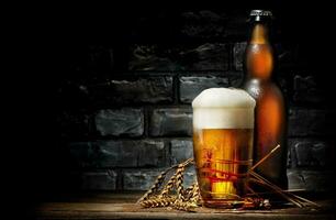 Beer in glass and bottle photo