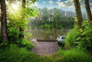 Fishing lake in sunny evening photo