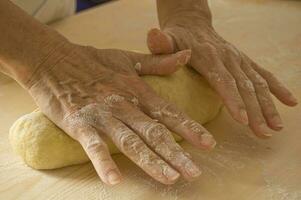 Hands Kneading Dough photo