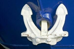 White Anchor on Blue Boat photo