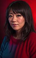 portrait photo of beautiful middle aged asian woman in dark room with light in background, generative AI