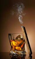 Glass of whiskey and cigar photo