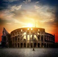 Colosseum and sunny sunrise photo